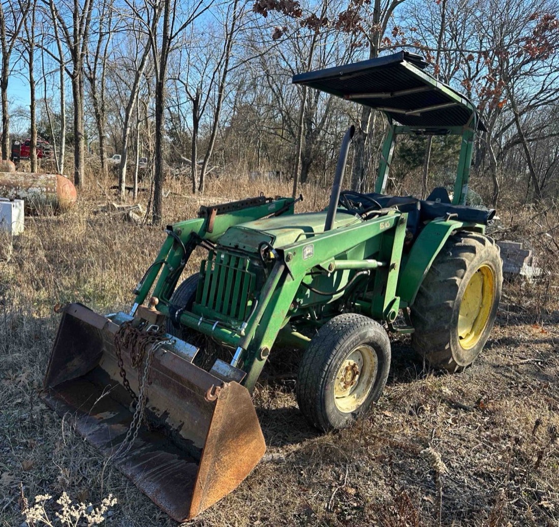 John Deere tractor with front loader, sold with a Middle Tennessee estate