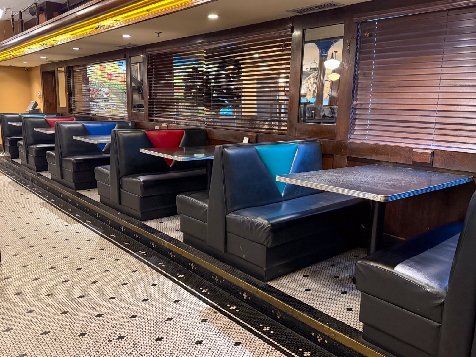 Dining room booths and tables at the Dalts American Grill complete liquidation