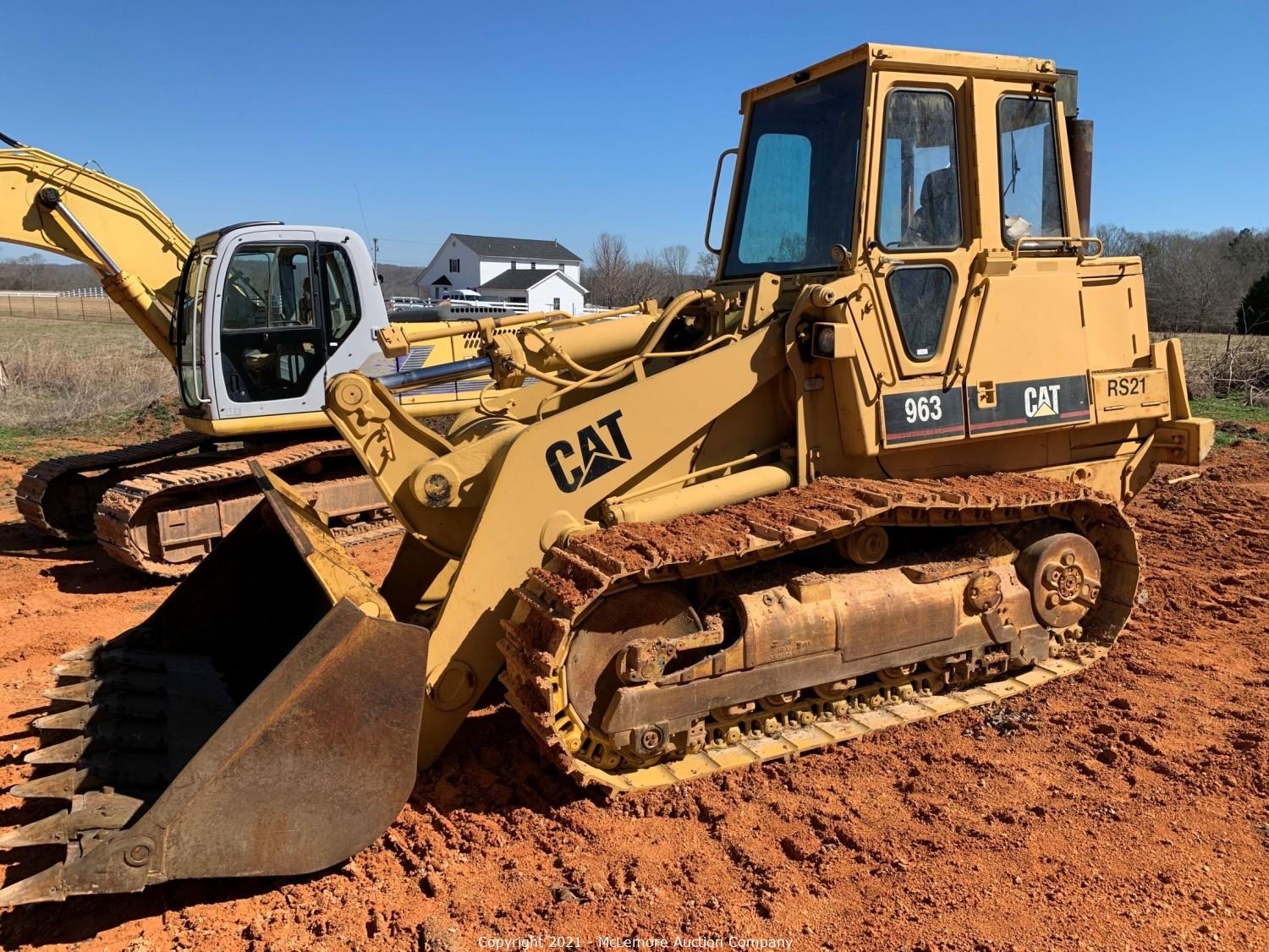 Caterpillar 963 track loader on red dirt at the Hunt & Mobley excavating contractor liquidation