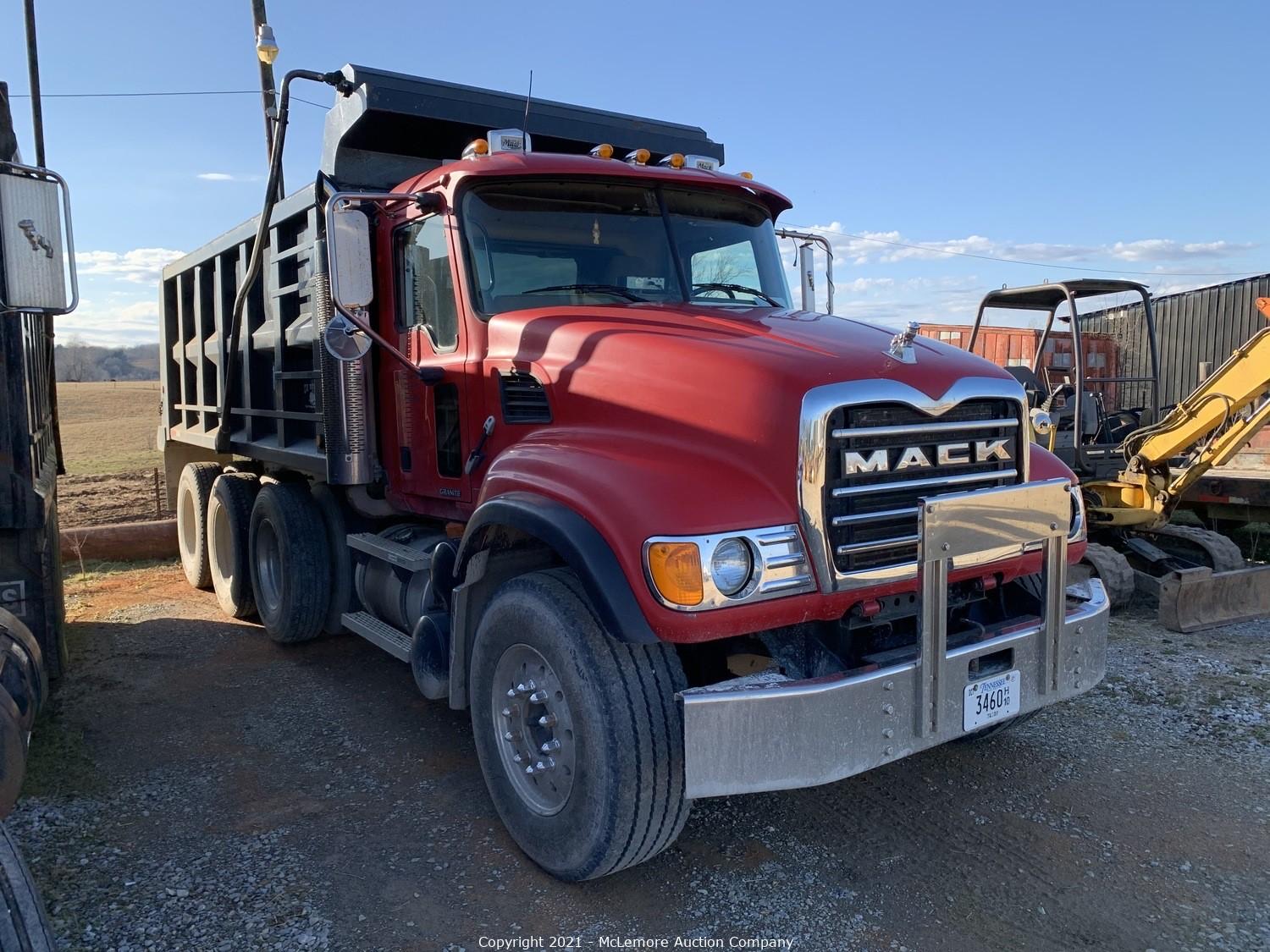 Mack Granite tri-axle dump truck in the equipment yard at the Hunt & Mobley excavating contractor liquidation