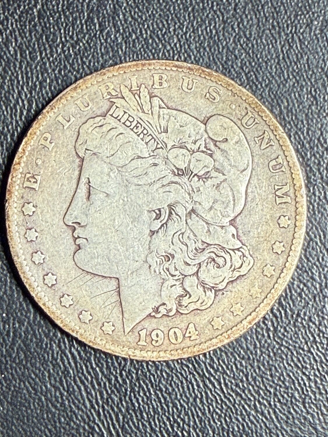 1904 Morgan silver dollar photographed for a McLemore Auction coin sale